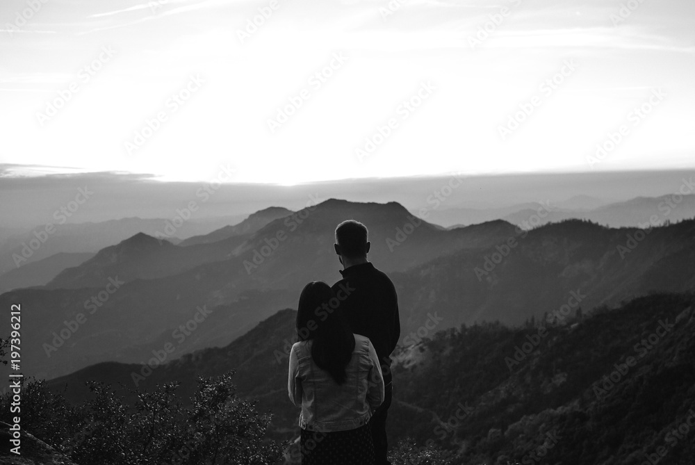 A Couple Looking Out Over the Layers of Mountains