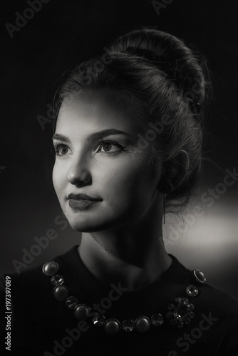 Beautiful girl with hair in a retro style