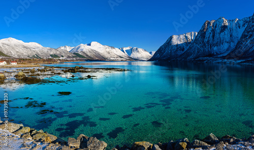 Panoramic view of beautiful winter lake with snowy mountains at Lofoten Islands in Northern Norway