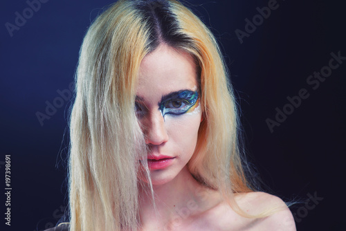 Fashion portrait of the blonde with bright makeup