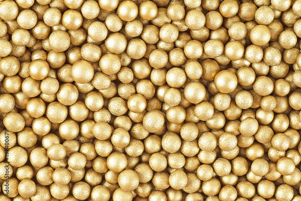 Close up of little golden balls, as background Close up of little golden balls, as background