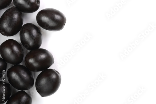 whole black olives isolated on white background with copy space for your text. Top view. Flat lay pattern © kolesnikovserg