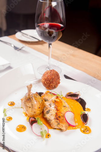 Guinea fowl, pumpkin puree, fried buckwheat, gravie sauce served in a restaurant photo