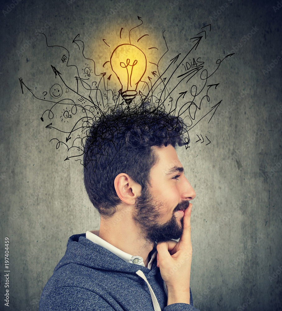 Young happy man has a bright idea Young happy man has a bright idea