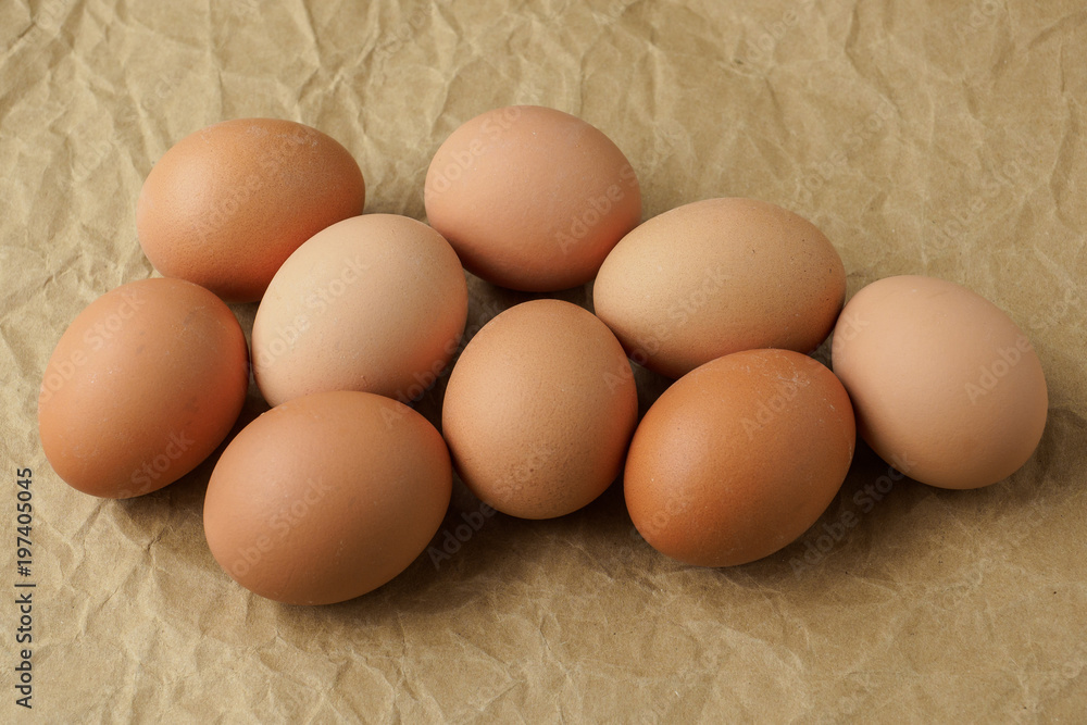 Fresh eggs on brown wrapping paper. Dietary products. Organic fresh eggs. Fresh eggs on brown wrapping paper. Dietary products. Organic fresh eggs.