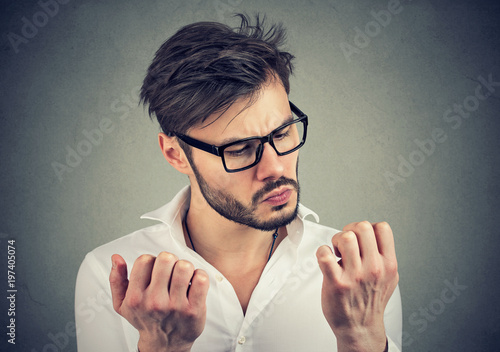 man with obsessive compulsive disorder exploring cleanliness of hands.