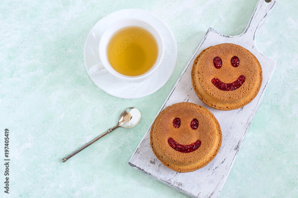 Funny homemade cupcakes in form of smiling face Funny homemade cupcakes in form of smiling face
