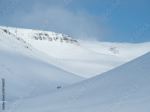 skiers in mountains