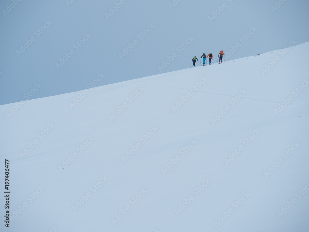 skiers on a slope