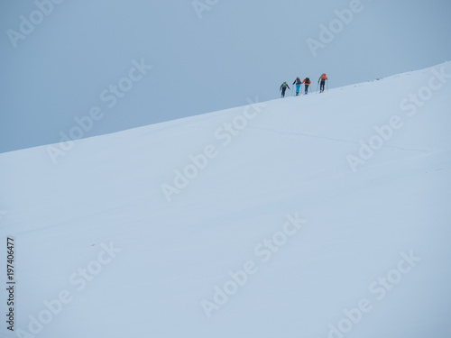 skiers on a slope