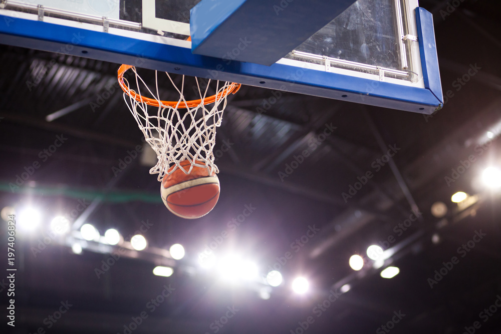 scoring during basketball game - ball going through hoop