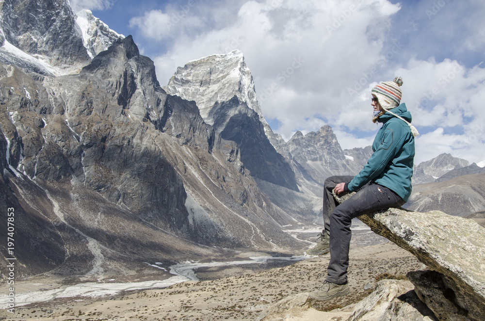 Woman on Everest Trek enjoying the view above Dingboche