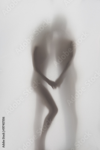 Beautiful couple body silhouette together. Woman and man hold each other.
