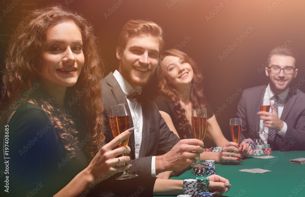 beautiful woman sitting at a table in a casino