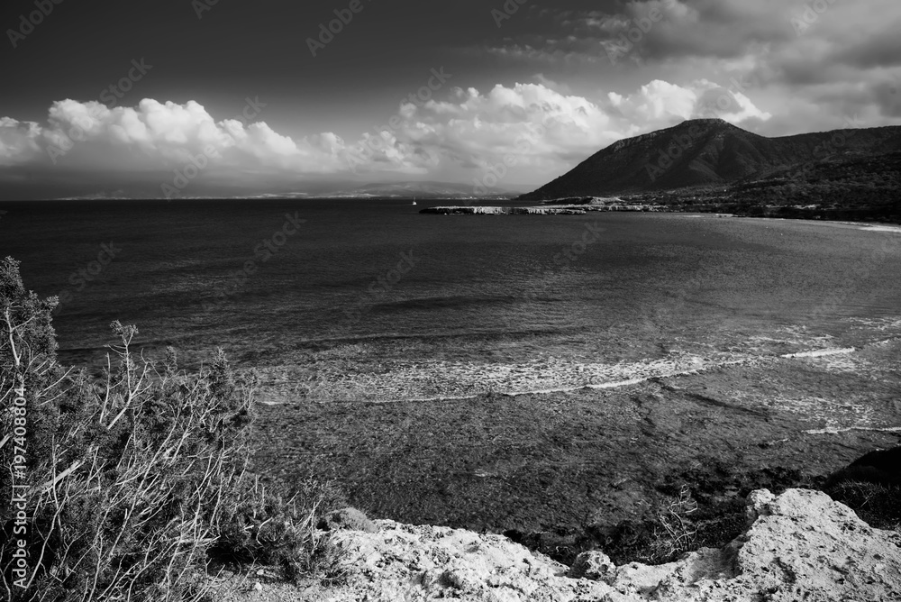 View to the Cyprus island sea coast with mountain. Akamas cape landscape. Natural seasonal summer vacation background.