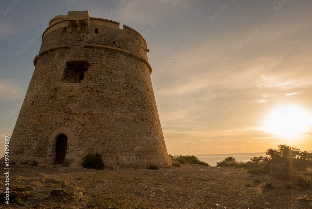 Medieval tower of Sal Rossa at sunrise in Ibiza Medieval tower of Sal Rossa at sunrise in Ibiza
