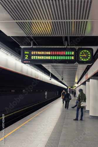 VIENNA, AUSTRIA - DECEMBER 2, 2017: People waiting for a train at a metro station in the Landstraße area. Landstraße is the 3rd municipal district of Vienna on the right bank of the Danube Canal.