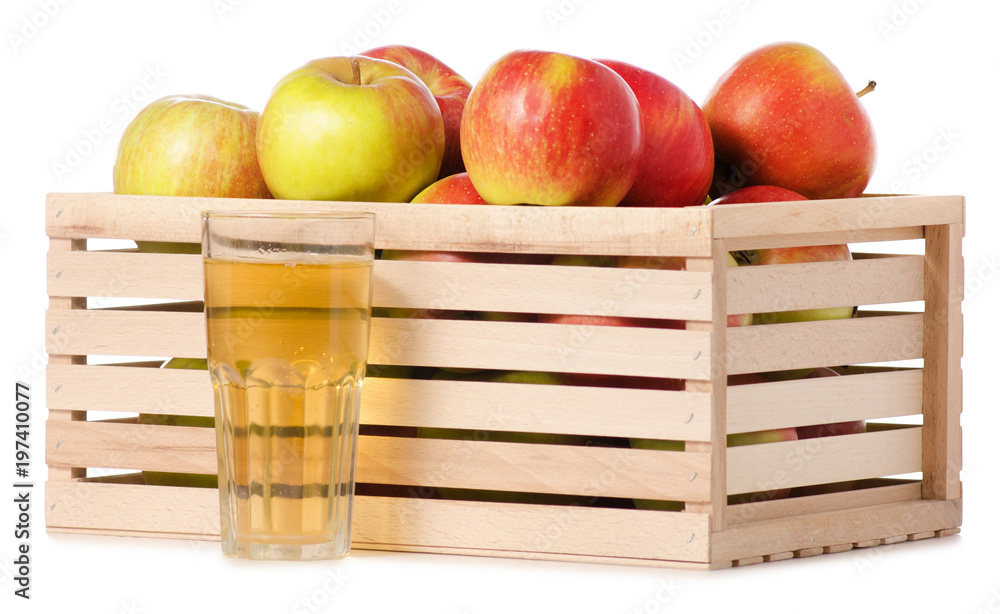 A wodden box of apples a glass of apple juice A wodden box of apples a glass of apple juice