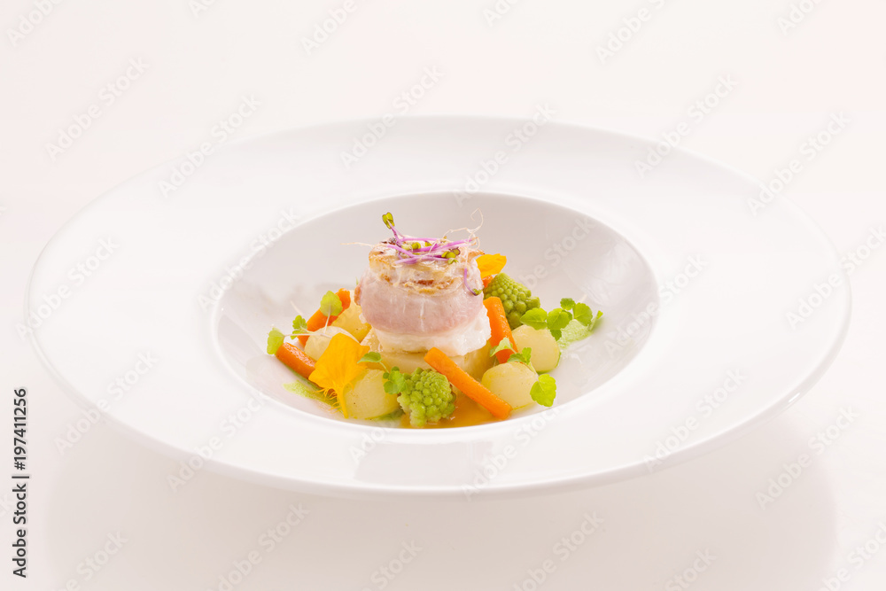 Gourmet dish with fish, with small vegetables