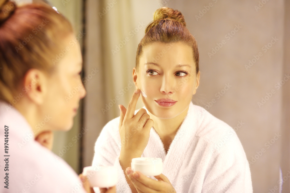 Magic anti-aging cream.Applying the cream Magic anti-aging cream.Applying the cream