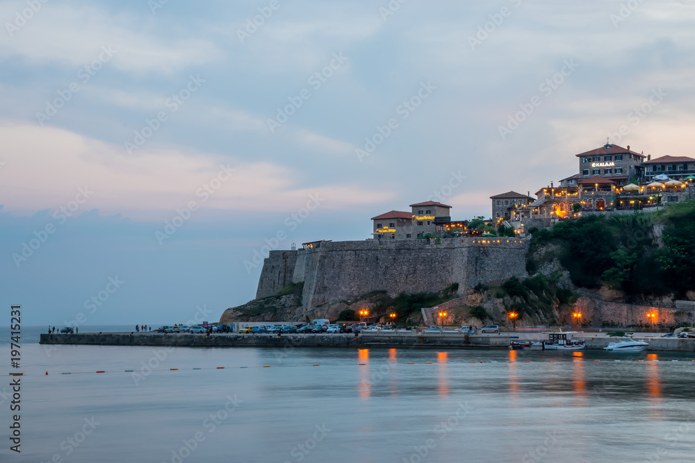 MONTENEGRO, ULCINJ - JUNE 02/2017: tourists went to the beach for a walk during sunset.