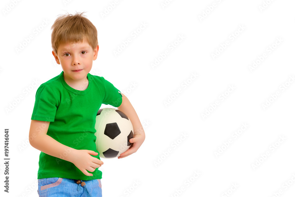 Little boy is playing with a soccer ball. Little boy is playing with a soccer ball.
