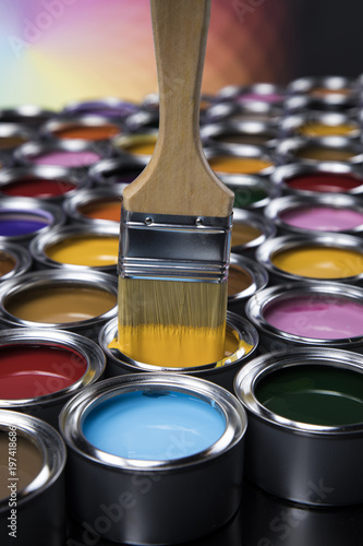 Colorful paint cans with paintbrush