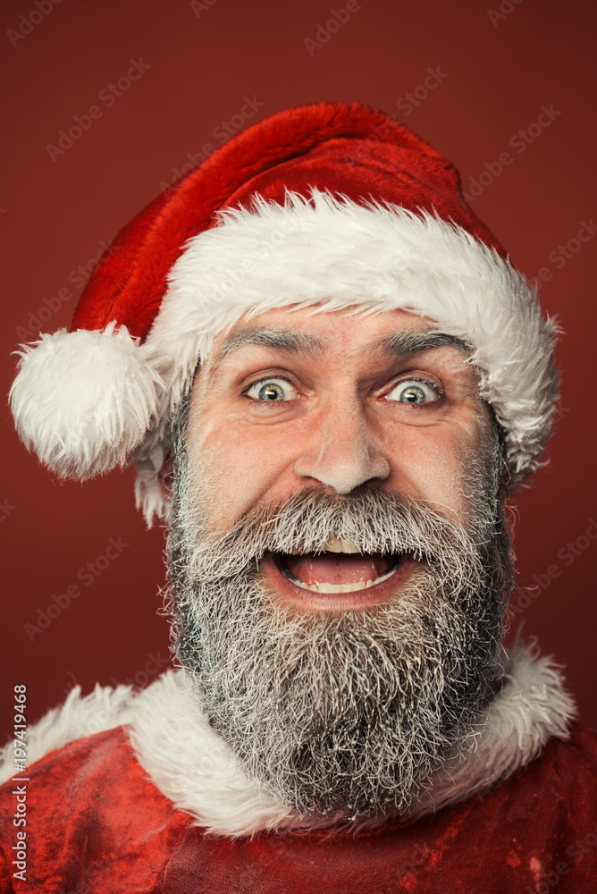 Cheerful Santa Claus. Christmas, new year and celebration concept - smiling Santa Claus hipster in red hat. Christmas man with beard. Cheerful Santa Claus. Christmas, new year and celebration concept - smiling Santa Claus hipster in red hat. Christmas man with beard.
