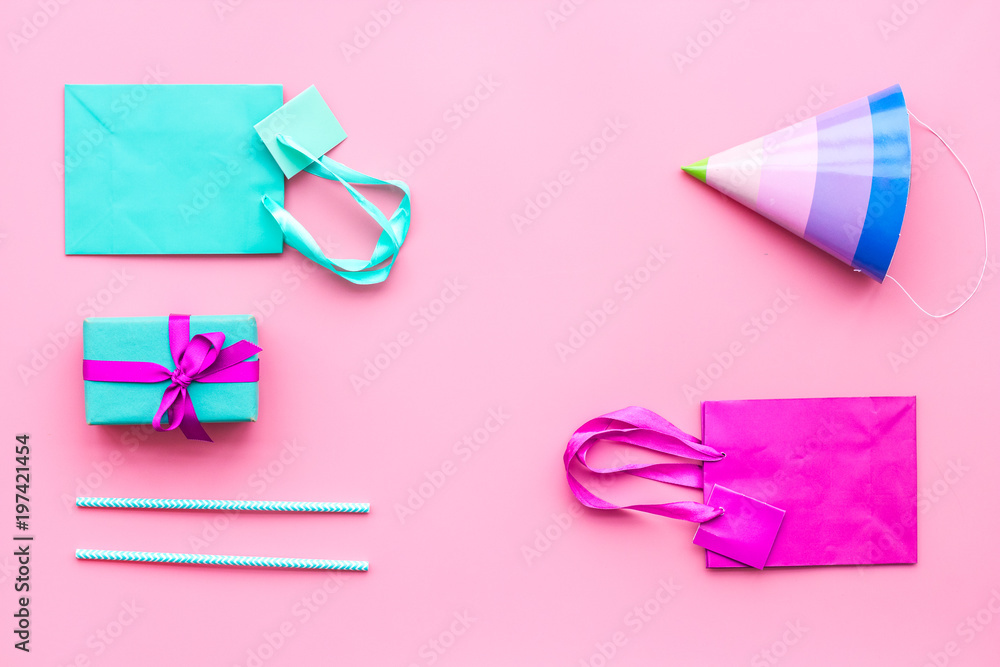 Gift box and colorful paper bag on pink background top view mock-up Gift box and colorful paper bag on pink background top view mock-up