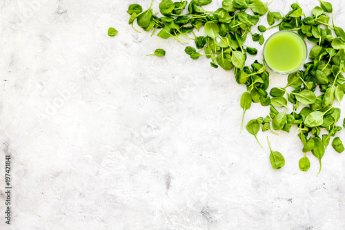 Fitness greeny drink with vegetables on stone background top view mock-up