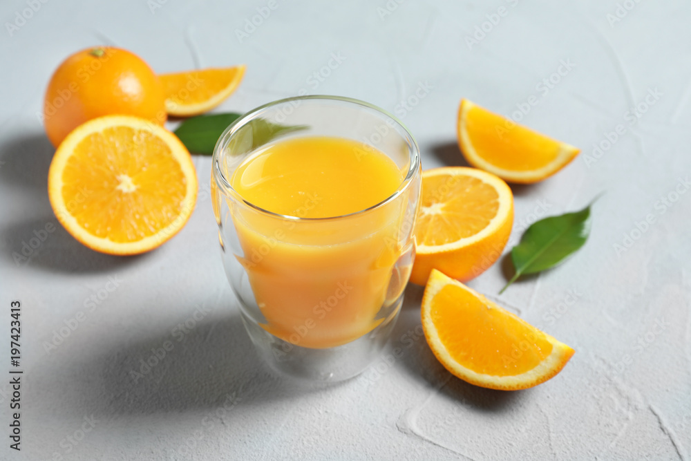 Glass of orange juice and fresh fruits on table Glass of orange juice and fresh fruits on table