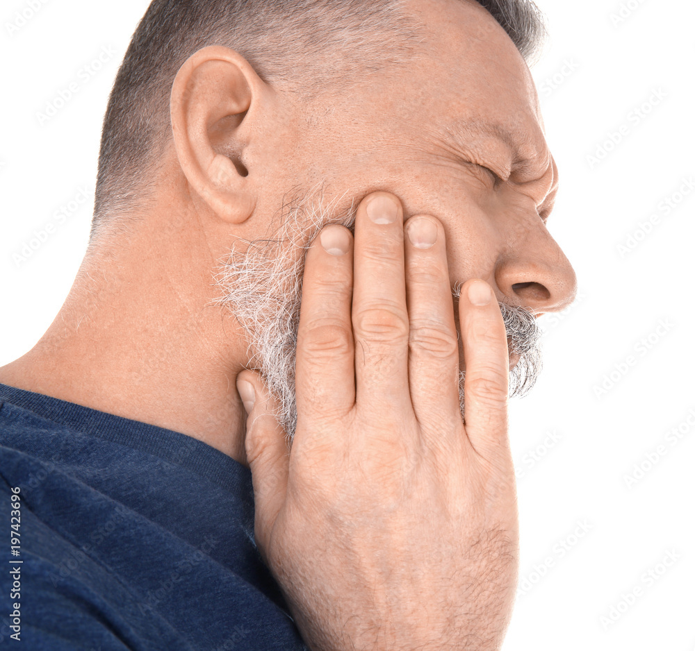 Fototapeta premium Man suffering from toothache on white background