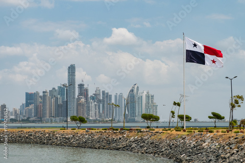 National flag of Panama with skyline of Panama City 