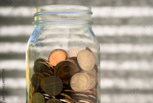 American Dollar Currency Coins in Jar Pennies Nickels Quarters Dimes