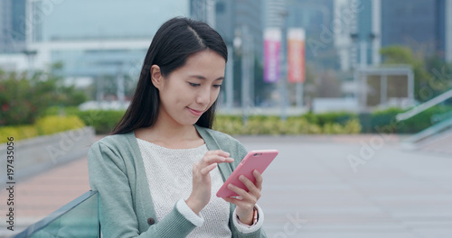 Photography Woman use of mobile phone in city
