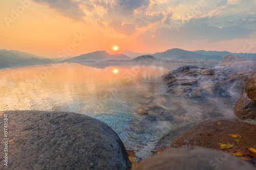 sunset above Mae Kajan Hot Spring at Wiang Pa Pao Chiang Rai Thailand. have hotspring pools both side the main road of Chiang Mai to Chiang Rai a lot of tourists visit there photo