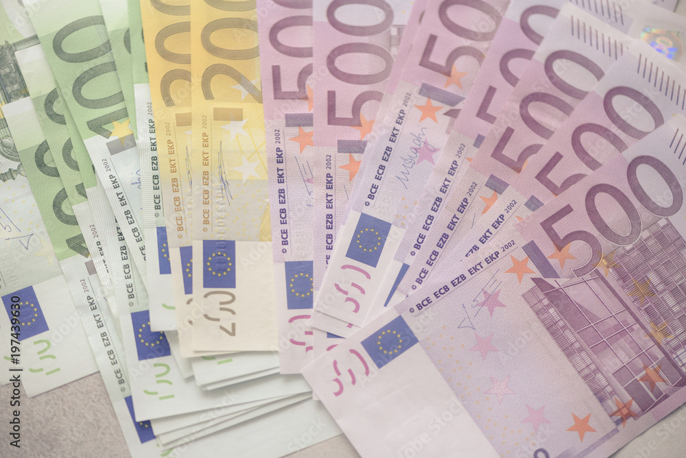 Euro currency money banknotes background. Payment and cash concept. Announced cancellation of five hundred euro banknotes. Top view. Toned image Euro currency money banknotes background. Payment and cash concept. Announced cancellation of five hundred euro banknotes. Top view. Toned image
