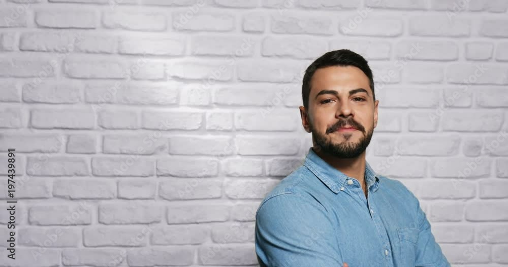 Facial Expressions Of Young Beard Man On Brick Wall Facial Expressions Of Young Beard Man On Brick Wall