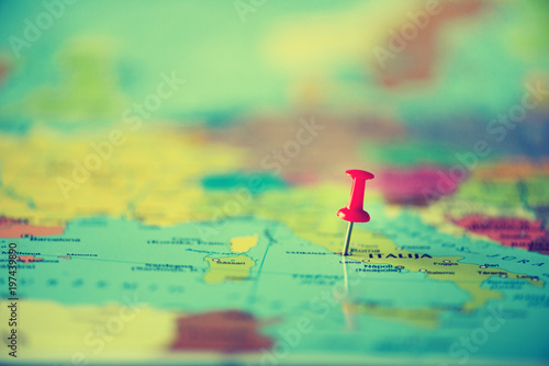 Red pushpin, thumbtack, pin showing the location, travel destination point on map. Copy space, lifestyle concept