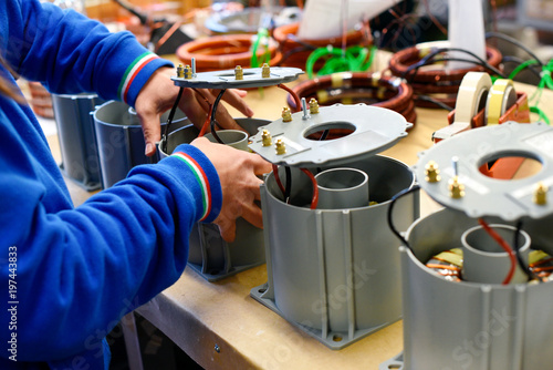 Man working on new electrical transformers