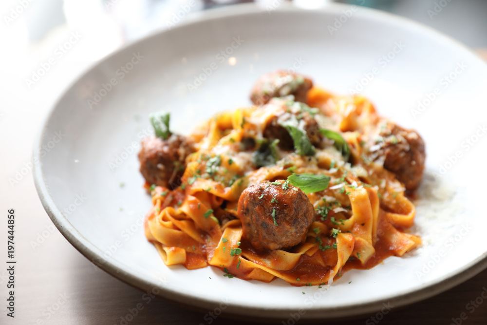 Spaghetti pasta with beef meatballs and tomato sauce on wood background . italian food Spaghetti pasta with beef meatballs and tomato sauce on wood background . italian food