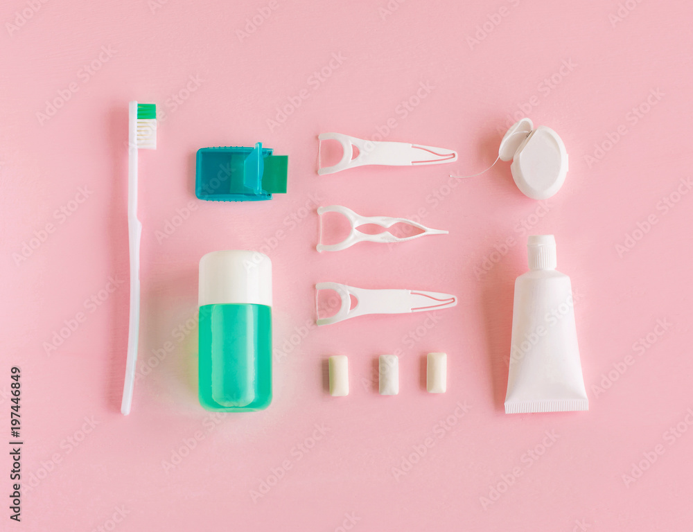 Toothbrushes, toothpaste, rinse and chewing gum set on pink background. Dental and healthcare concept. Free copy space. Hygiene. Toothbrushes, toothpaste, rinse and chewing gum set on pink background. Dental and healthcare concept. Free copy space. Hygiene.