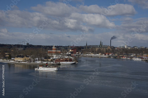 Winter in Stockholm a cold and icy day with landmarks, ships and ferries at the waterfront