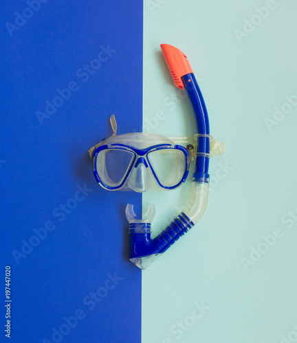 Blue Diving Mask and Snorkel on blue Background. Diving equipment.
