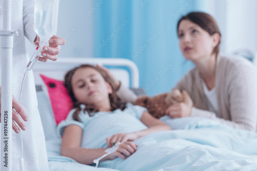 Nurse chaning a drip Nurse chaning a drip
