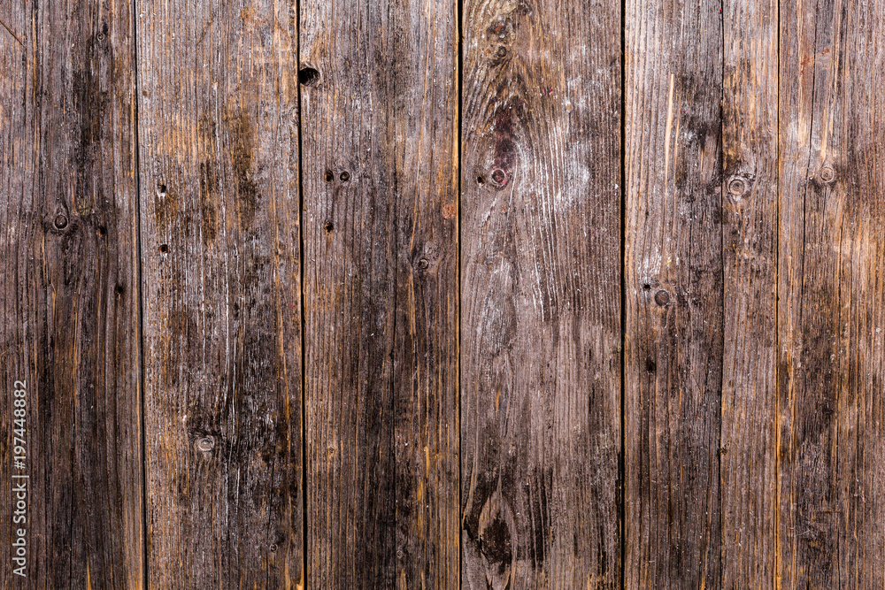 The old natural wooden boards are dark brown with a beautiful deep clear texture The old natural wooden boards are dark brown with a beautiful deep clear texture