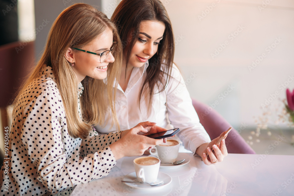 girls use their break from work to drink coffee and chat girls use their break from work to drink coffee and chat