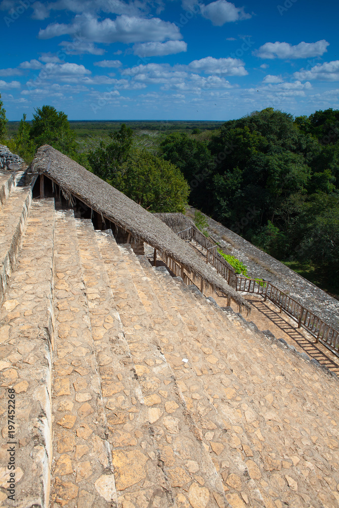 Very steep stairs in majestic ruins in Ek Balam. Yucatán, Mexico.