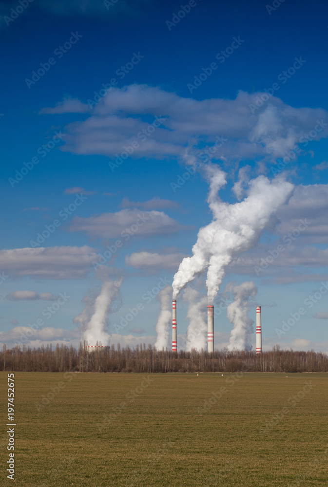 A coal-fired power station in spring  agricultural landscape. Czech republic
