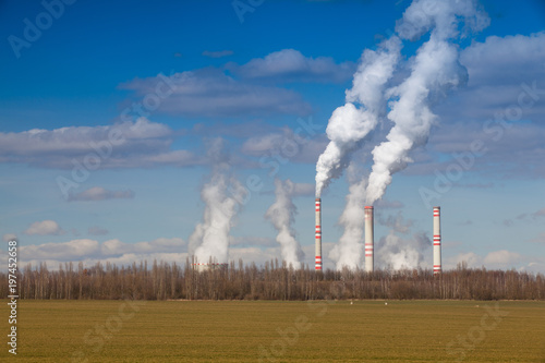 A coal-fired power station in spring agricultural landscape. Czech republic